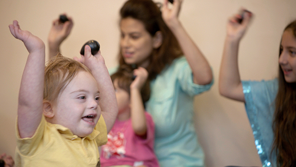 boy with special needs enjoying mixed-age class